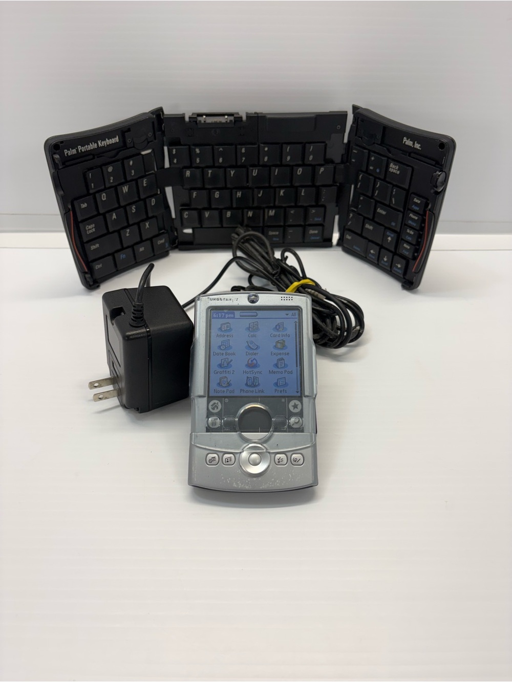 Palm Tungsten T2 PDA with dock, keyboard and brand new battery installed.